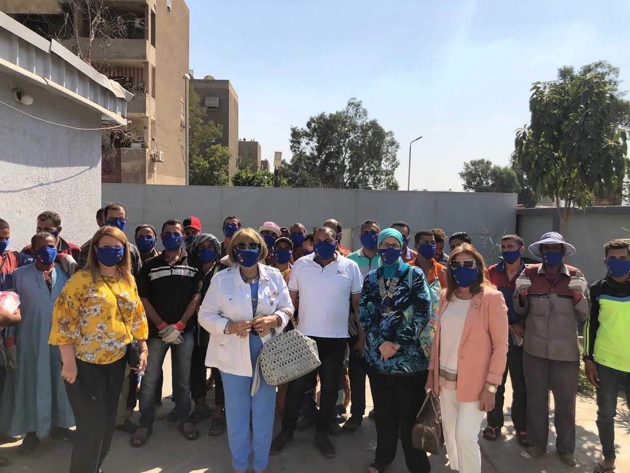 1-Members of IWC of Nasr City and the clearners Wearing the donated Masks