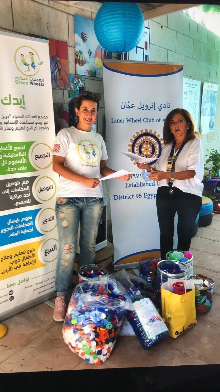 1- Mrs.Jida Farradi President of IWC of Amman with the plastic caps