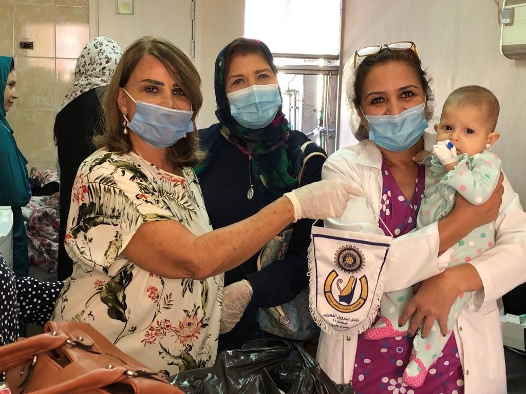 1-The young girl with members of IWC of el Tahrir