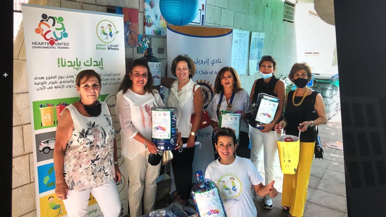 Members of IWC of Amman with the plastic caps ( Green Wheelz) Initiative