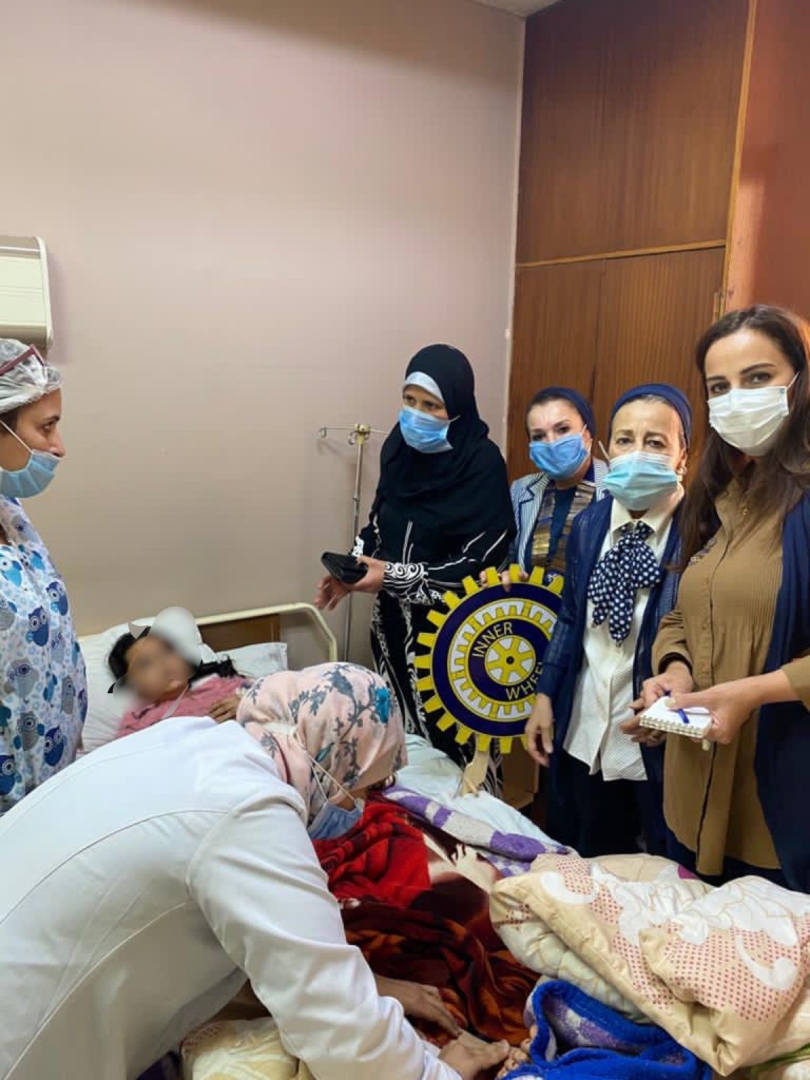 1- Members of IWC of Giza with the young Child and the doctor