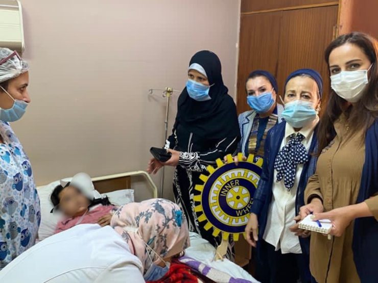 1- Members of IWC of Giza with the young Child and the doctor