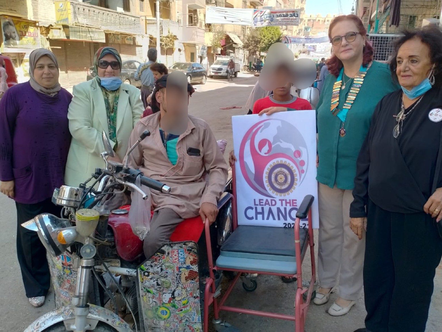 1- President & members of IWC of El Minya with the Wheel Chair