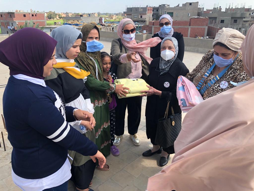 Mrs. Farah El Shenawi distributed fabrics to be manufactured as bed sheets