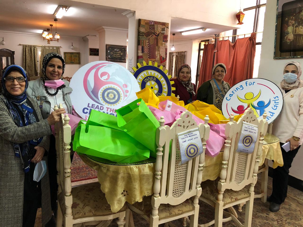 IWC of El Mansoura provide the girls with winter clothes & food supplies to the girls