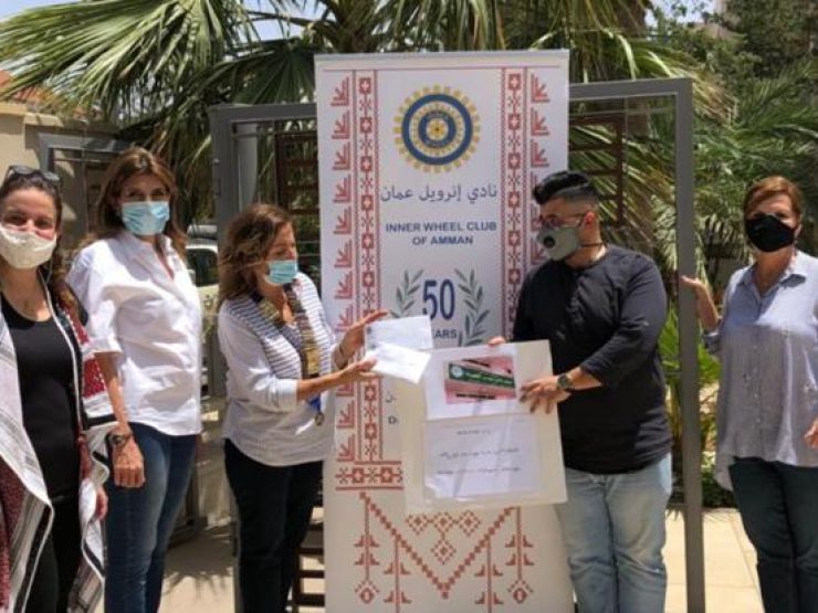 1- IWC of Amman donating shopping coupons to Wadi Moussa Charity Society
