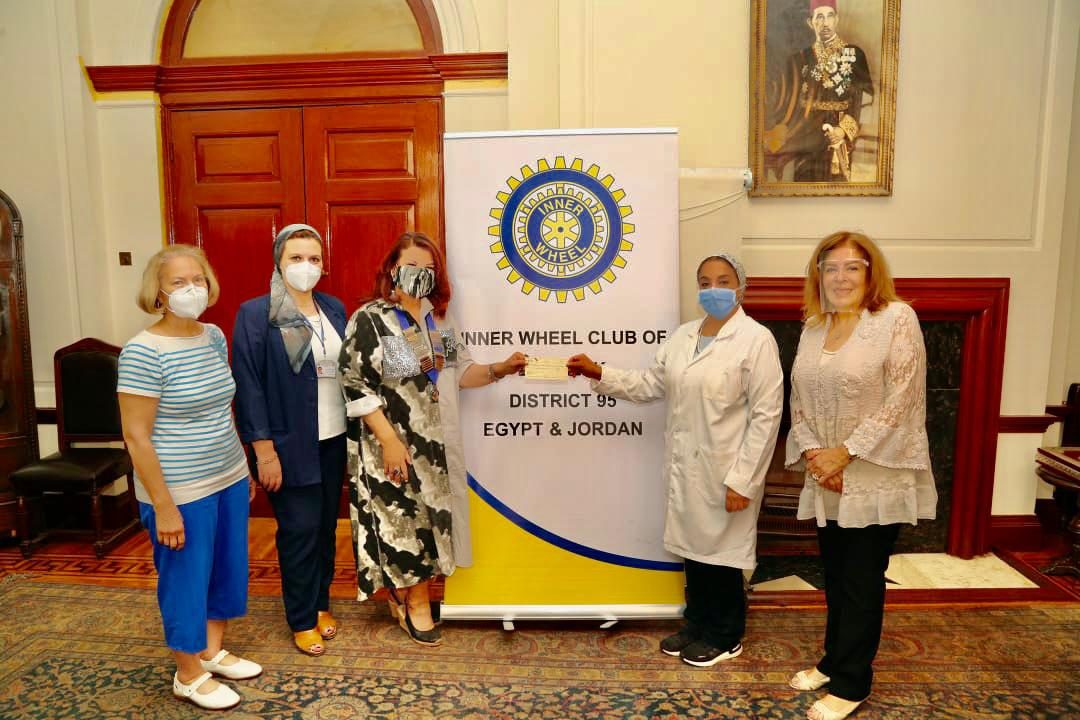 1-Mrs. Samia Abou El Fetouh & members of IWC of Zamalek donating a check to Dr. Hala Salah