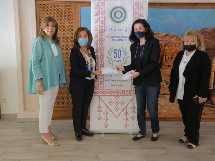 1-President of IWC of Amman Presented the vouchers to the Excutive director of the fund