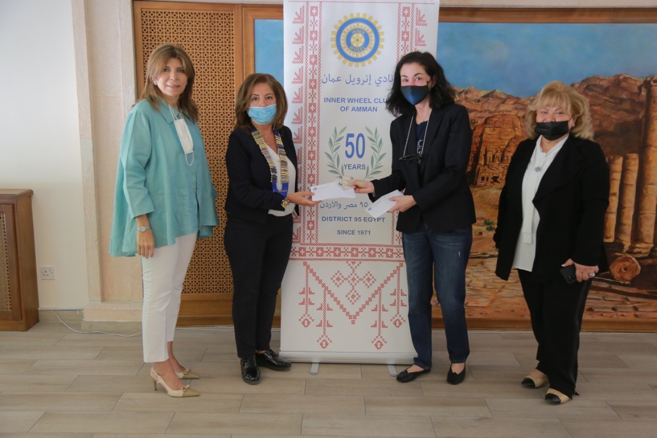 1-President of IWC of Amman Presented the vouchers to the Excutive director of the fund