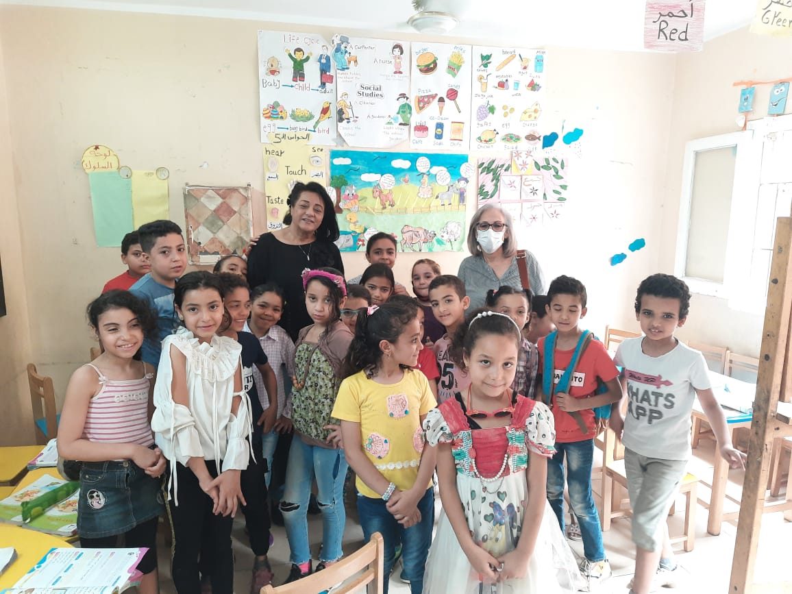 1-President of IWC of Lotus Misr & the Honorary Secretary with the orphans