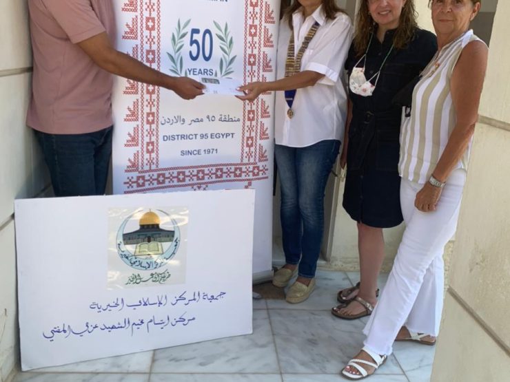 1-President of IWC of Amman delivered a Cheque to buy Eid new clothes to Mortar Azmi Al Mufti center for Orphans