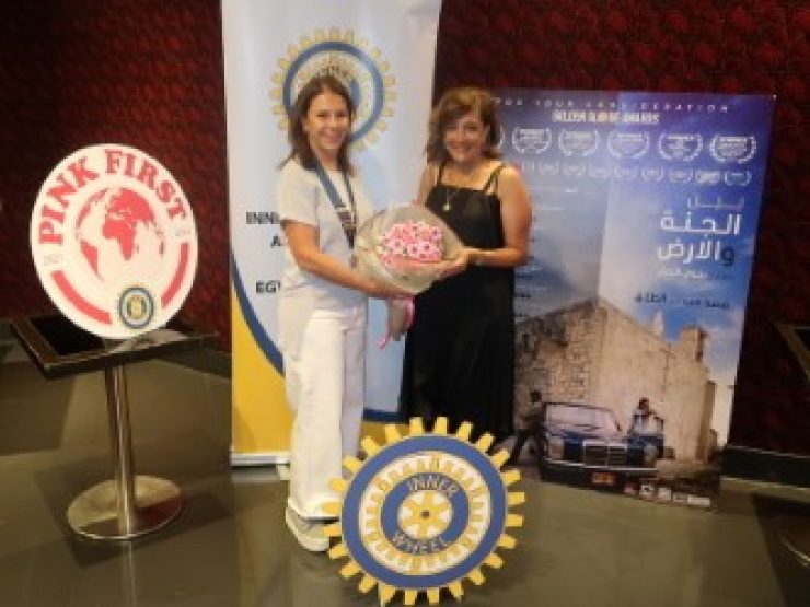 1-Lynne Farradj President of IWC of Petra offered bouquet of flowers to Najwa Najar director of the film