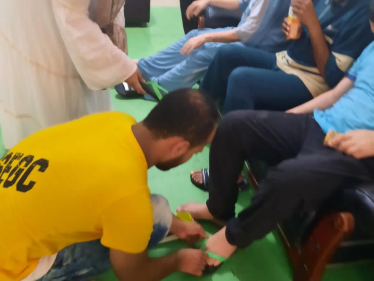 1- President of IWC of Alexandria Sporting providing Shoes for the orphanages for disabled