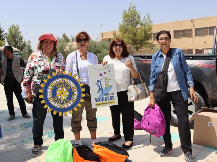 1-Mrs.Vivian Anz President of IWC of Amman & Mrs. Abeer Dajani Vice D.Chairman & members of the Club with the Donated School bags