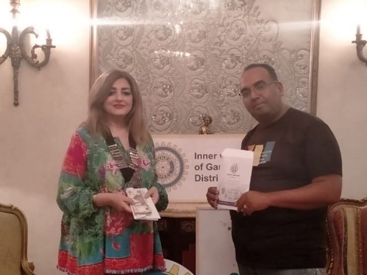 President of IWC of Garden City presented a check to “Al-Baqiyat Al-Salihat Association”for Alzheimer patients.