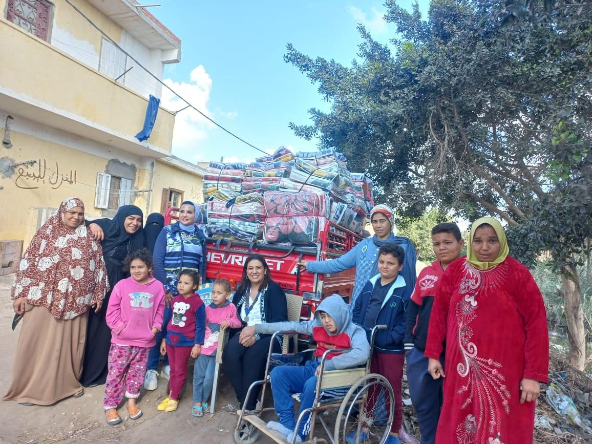 President of IWC of Alexandria El Nozha Distributing The Blankets