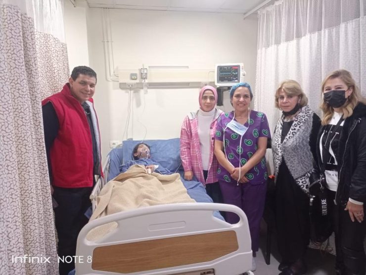 Members of IWC of El Tahrir with the child after the cardiac catheterization operation