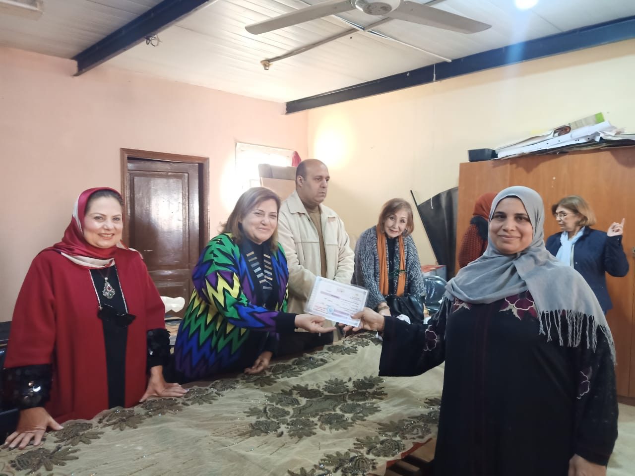 1-President of IWC of Nile Distributed certificate to a woman succeeded in the Illiteracy classes