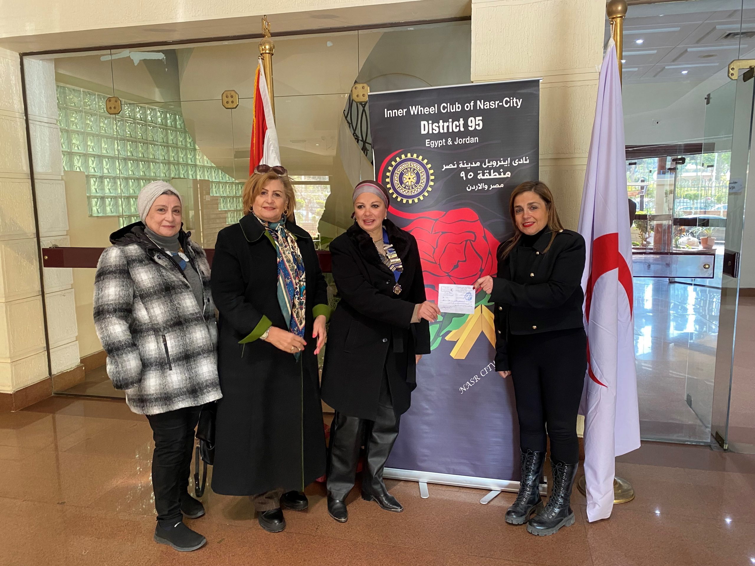 1- The IWC of Nasr City donated a cheque to the earthquake victims